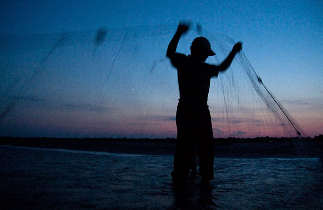 Antip Listarov sets his gill-nets at dusk in the Black Sea, near Sulina.